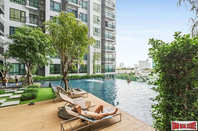 Rhythm Sukhumvit 36 | Comfortable One Bedroom Thong Lo Condo for Rent with City & Pool Views-0