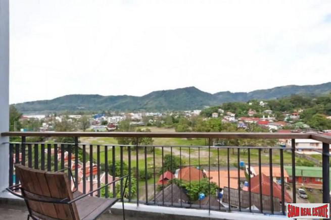 Icon Park Condominium | Two Bedroom Kamala Duplex with Large Open Windows and Green Views